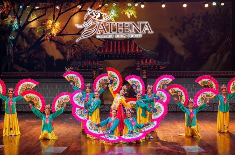 Dancers on stage at Athena cabaret show wearing colorful traditional dress