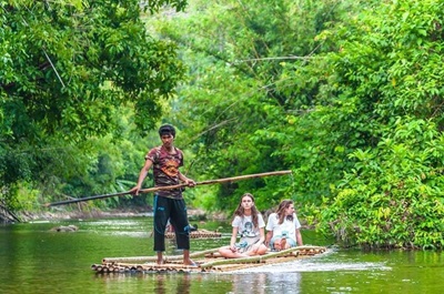 Rafting on the river through the tropical jungle