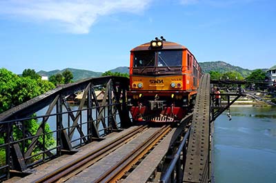 A train on the Death Railway crossing the river Kwai