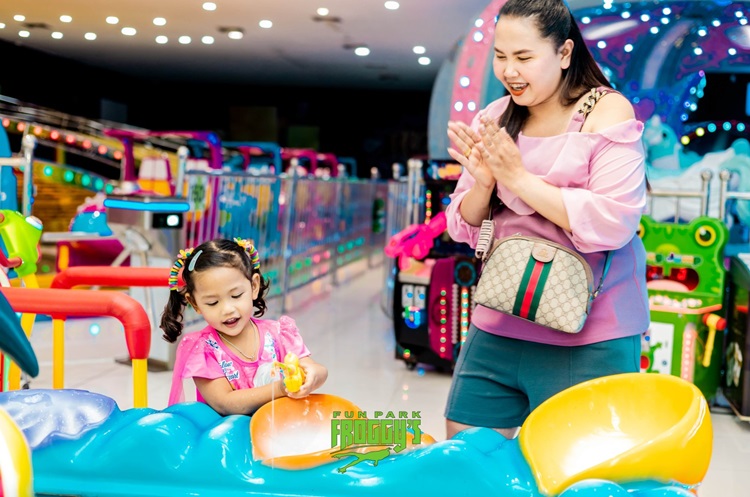 A child playing at Froggy’s Amusement Park