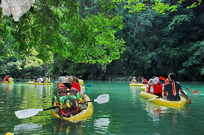 Sea canoes on the emerald waters of Phang Nga Bay